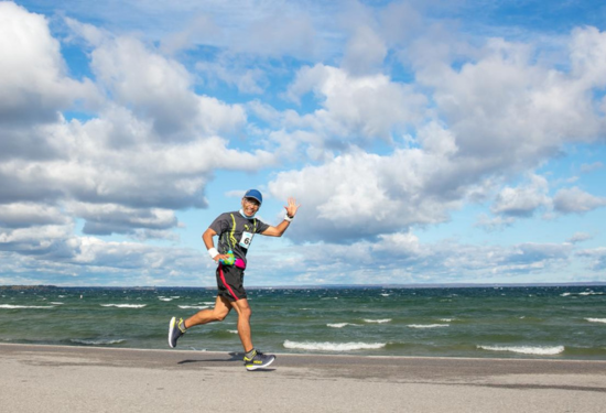 marathon runner on shore of Lake Simcoe