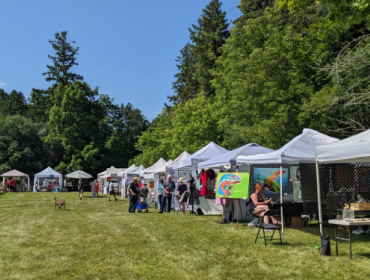 series of tents with art hanging
