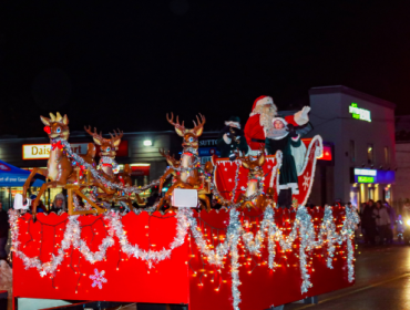 parade float with Santa Claus and the reindeer on it