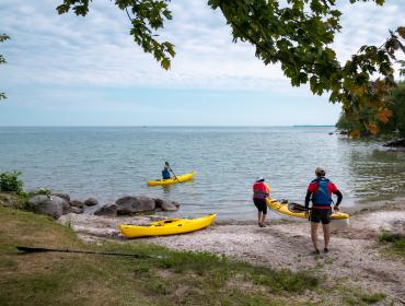 paddling on shore of Lake Simcoe